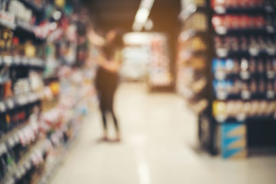 Blurred image of man standing at store