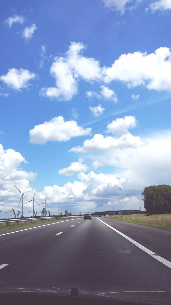 transportation, road, sky, road marking, the way forward, mode of transport, cloud - sky, car, diminishing perspective, landscape, vanishing point, cloud, land vehicle, country road, highway, cloudy, journey, travel, blue, on the move