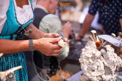 Midsection of man preparing food