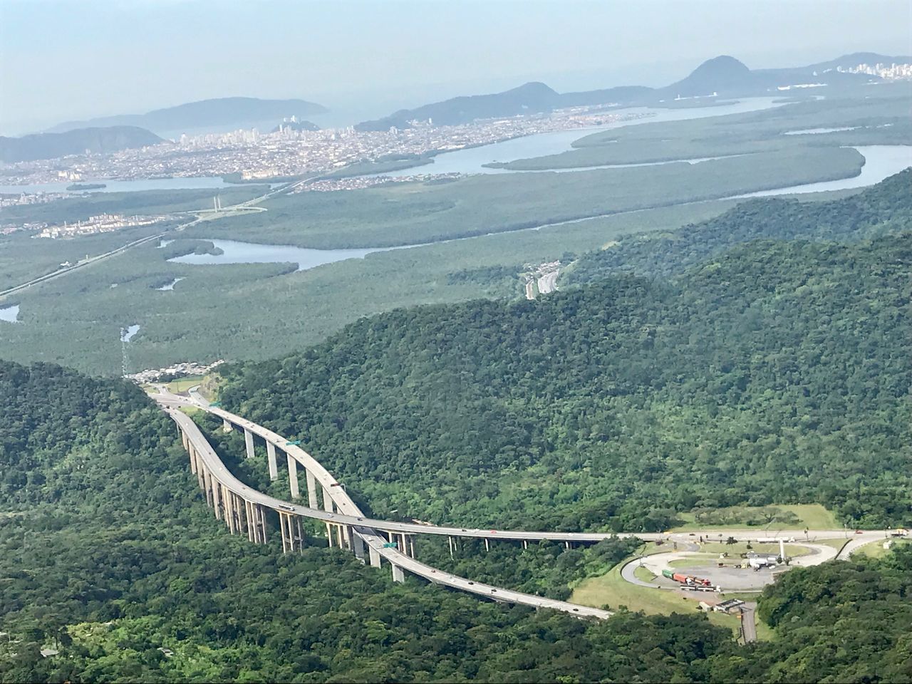 mountain, scenics - nature, mountain range, beauty in nature, built structure, environment, transportation, architecture, plant, non-urban scene, connection, landscape, nature, tree, day, high angle view, tranquility, no people, road, tranquil scene, bridge - man made structure, mountain road, outdoors, winding road