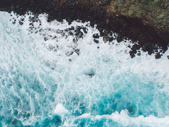 High angle view of water splashing in sea