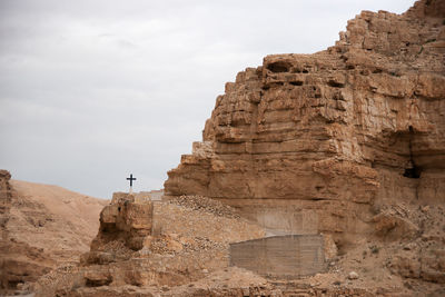 Low angle view of rock formations against sky