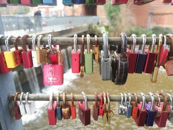 Close-up of love padlocks hanging in row