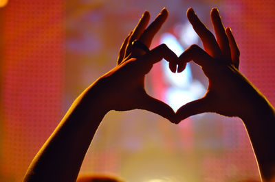 Close-up of hand holding heart shape