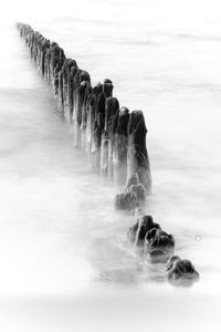 High angle view of posts at sea