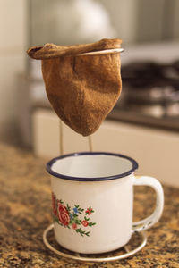 Close-up of coffee cup on table