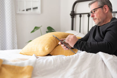 Man sitting on table at home