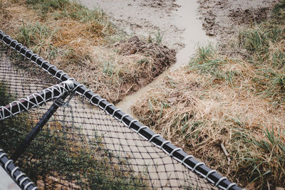 High angle view of railroad tracks on field