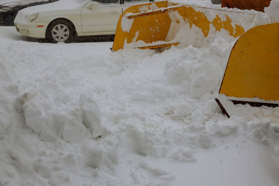 Close-up of snow covered car