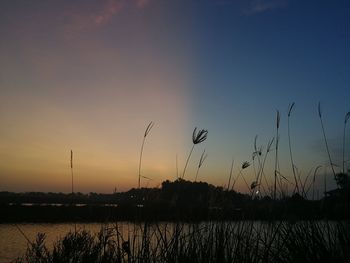 Scenic view of silhouette landscape against romantic sky at sunset