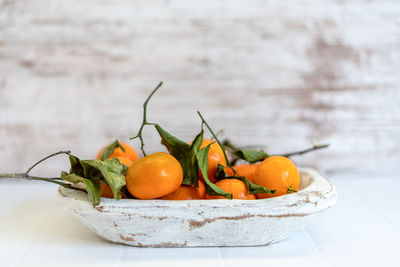 Close-up of fruits in bowl on table