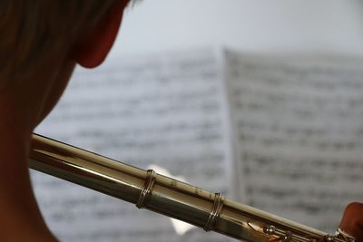 Cropped image of musician playing flute