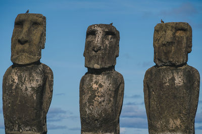 Moai statues against sky