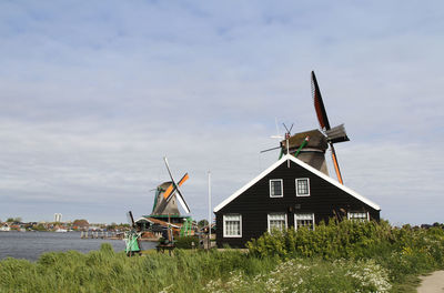 Traditional windmill against sky