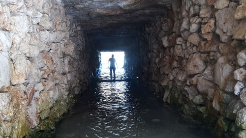 Rear view of man in water