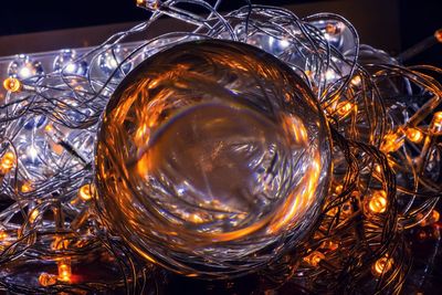 High angle view of illuminated glass on table