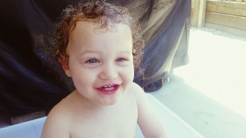 Close-up portrait of smiling boy