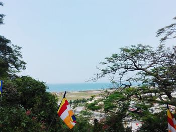 Scenic view of flag against clear sky