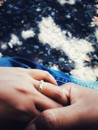 Close-up of couple holding hands