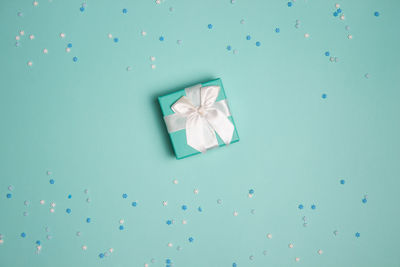 Directly above shot of gift box against blue background