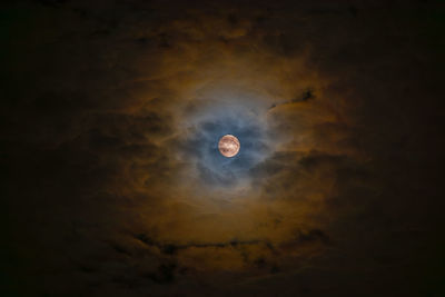 Low angle view of moon against sky at night