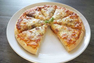High angle view of pizza in plate on table