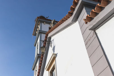 Low angle view of building against clear blue sky