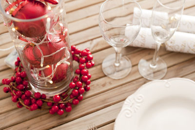 Close-up of wine glasses on table