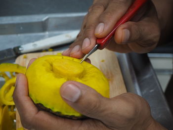 Midsection of woman holding fruits