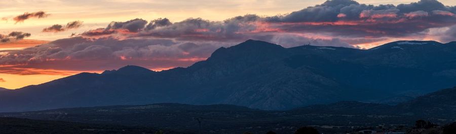 Scenic view of mountains against sky during sunset