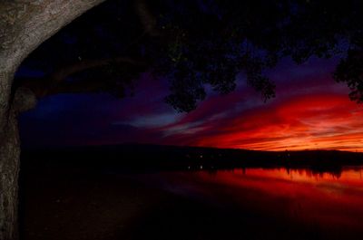 Scenic view of lake at sunset