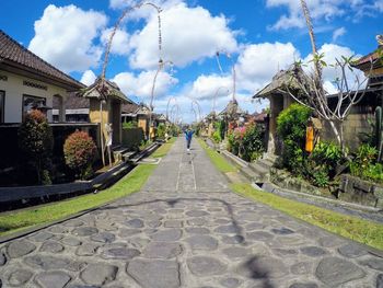 Panoramic view of buildings against cloudy sky