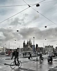 People riding bicycle on road