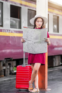 Portrait of woman standing in train