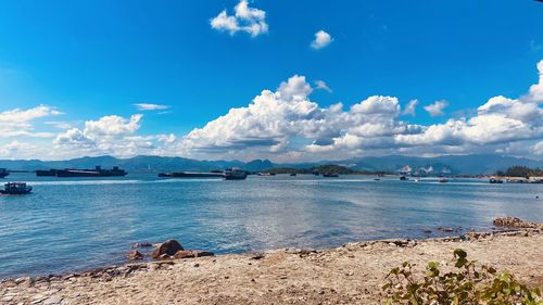 Scenic view of sea against blue sky