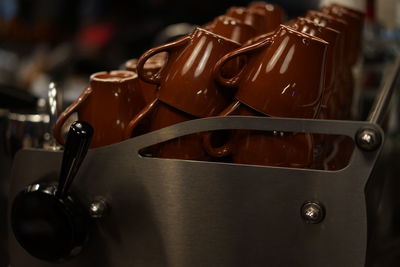 Close-up of brown cups at cafe