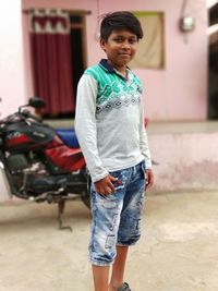 Portrait of smiling girl standing outdoors