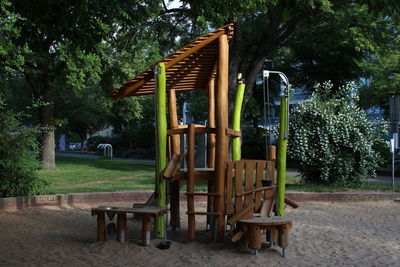 Empty chairs and table in park