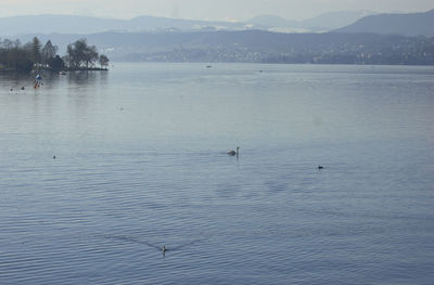 Scenic view of lake with mountains in background