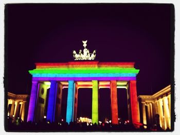 Low angle view of illuminated building at night