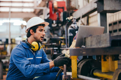 Young man working in workshop