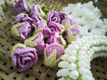 Close-up of multi colored flowers in basket