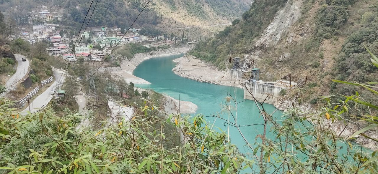 HIGH ANGLE VIEW OF RIVER BY TREES