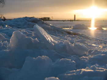 Scenic view of snow covered landscape at sunset