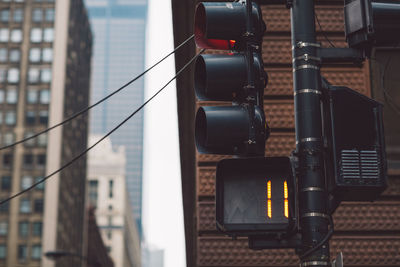 High angle view of traffic light against modern building in city