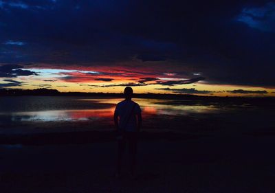 Silhouette of man standing on beach