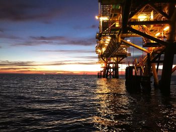 Scenic view of sea against sky at sunset