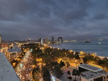 Dawn in a city under a dramatic sky