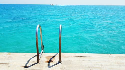 High angle view of swimming pool by sea against sky