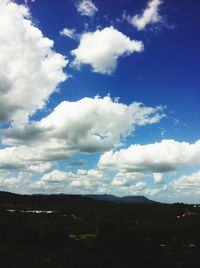 Scenic view of mountains against cloudy sky